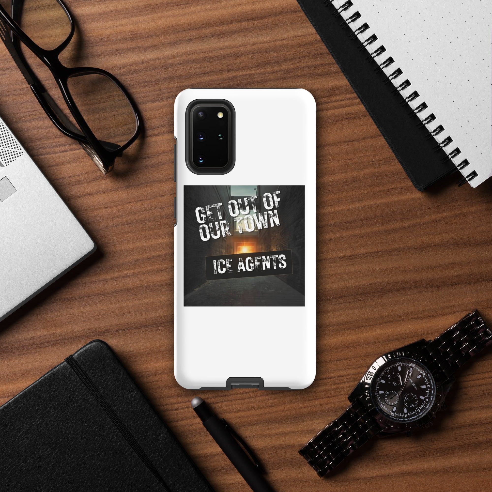Black camera module on white phone case with “Ice Agents” street-style slogan print.