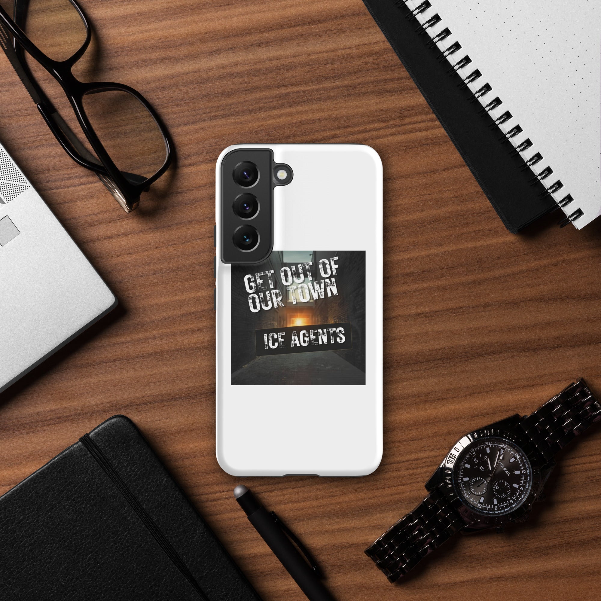 White Samsung phone case showing “ICE AGENTS” text design with cutout for camera