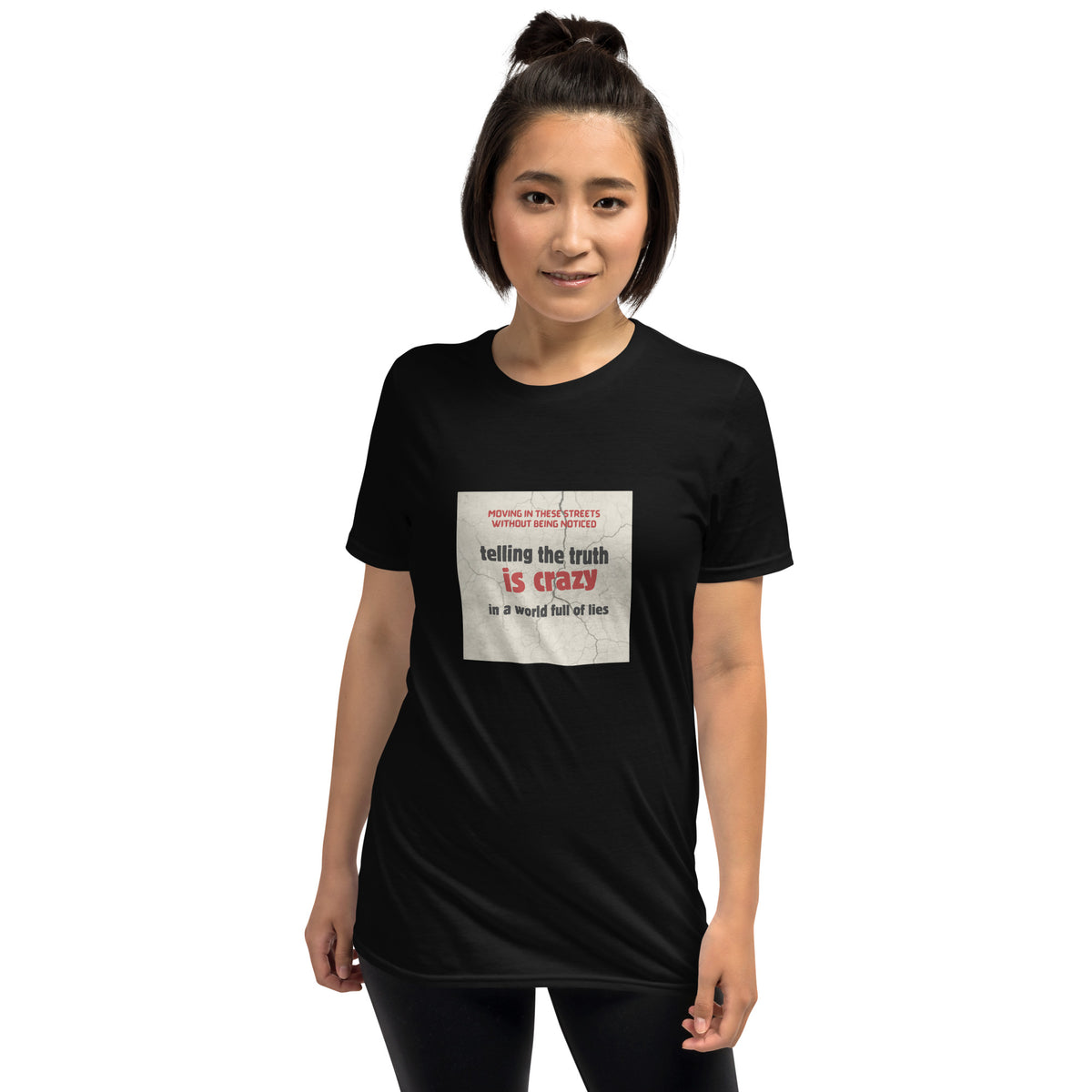 Unisex black graphic t-shirt with front square “telling the truth is crazy” print
