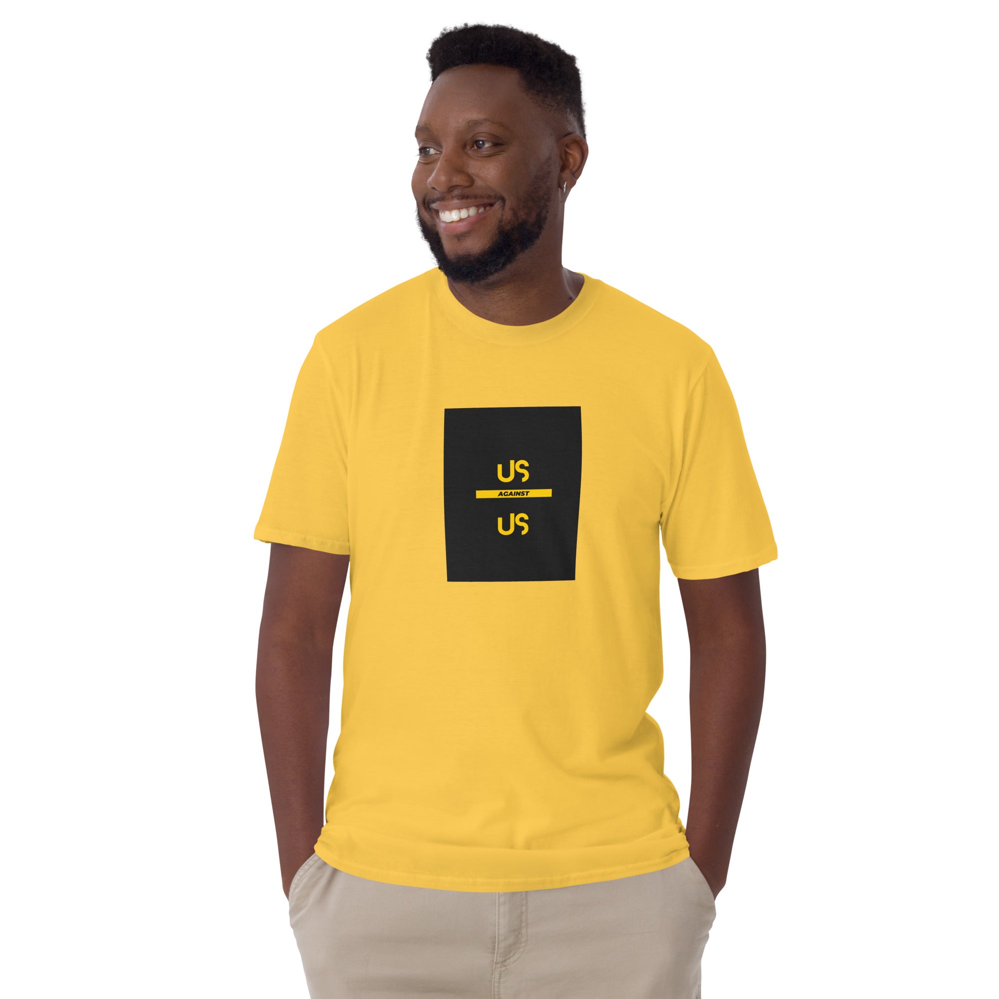 Yellow unisex short-sleeve T-shirt with front square “US AGAINST US” graphic