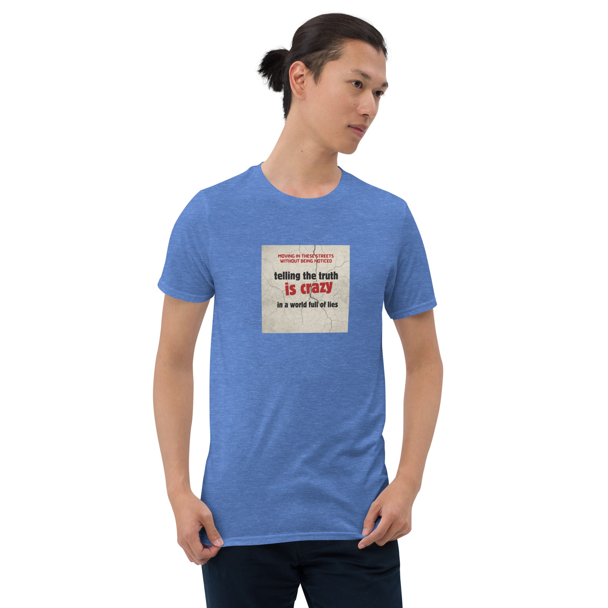Blue heather T-shirt with front square graphic text: “telling the truth is crazy”