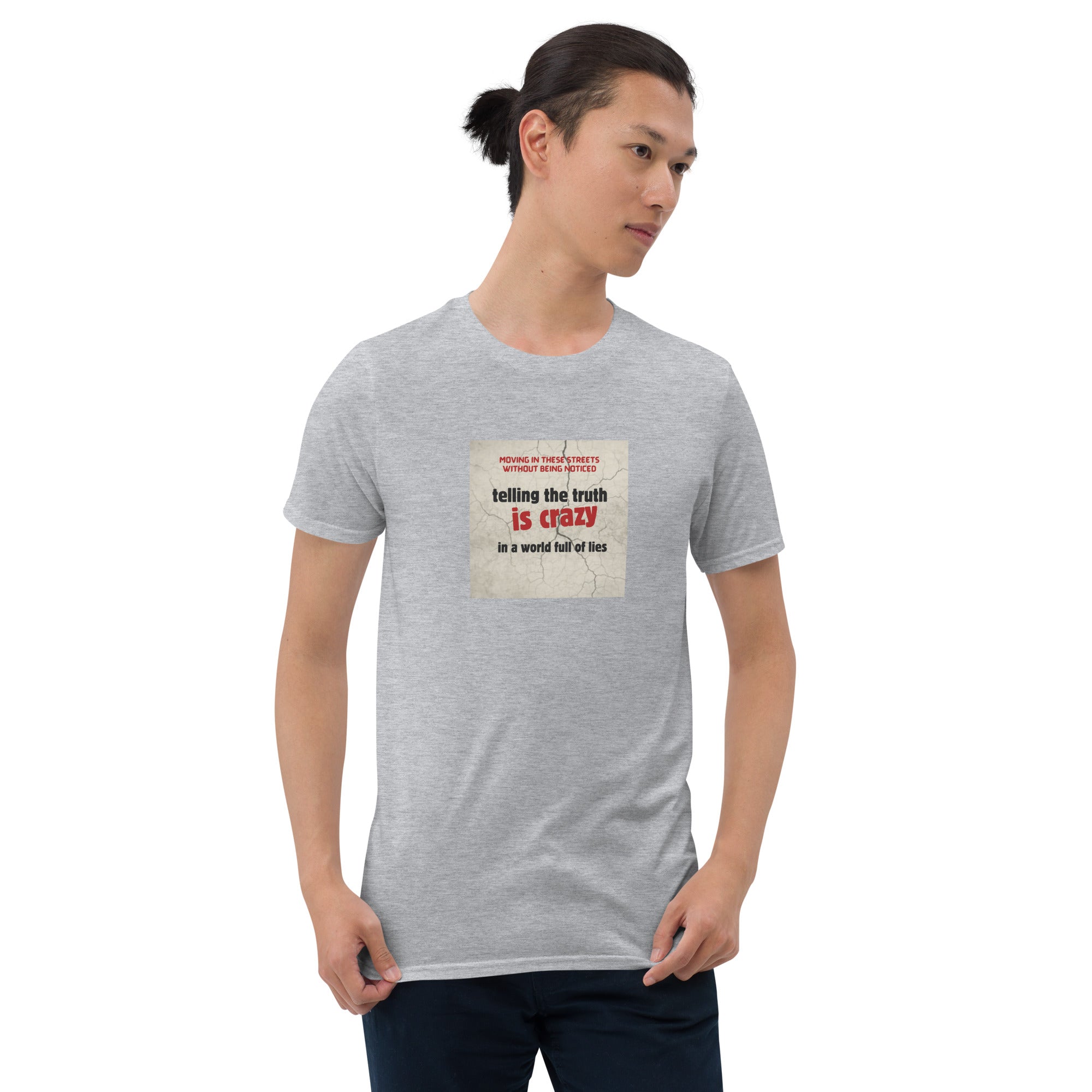 Heather gray T-shirt with front graphic: “telling the truth is crazy”