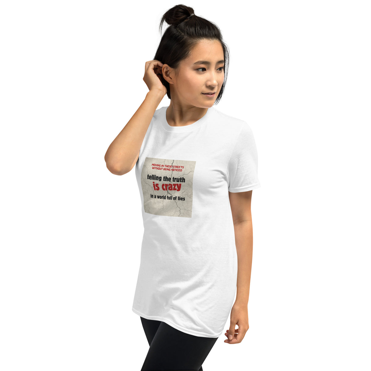 Unisex white graphic t-shirt with front square “telling the truth is crazy” print