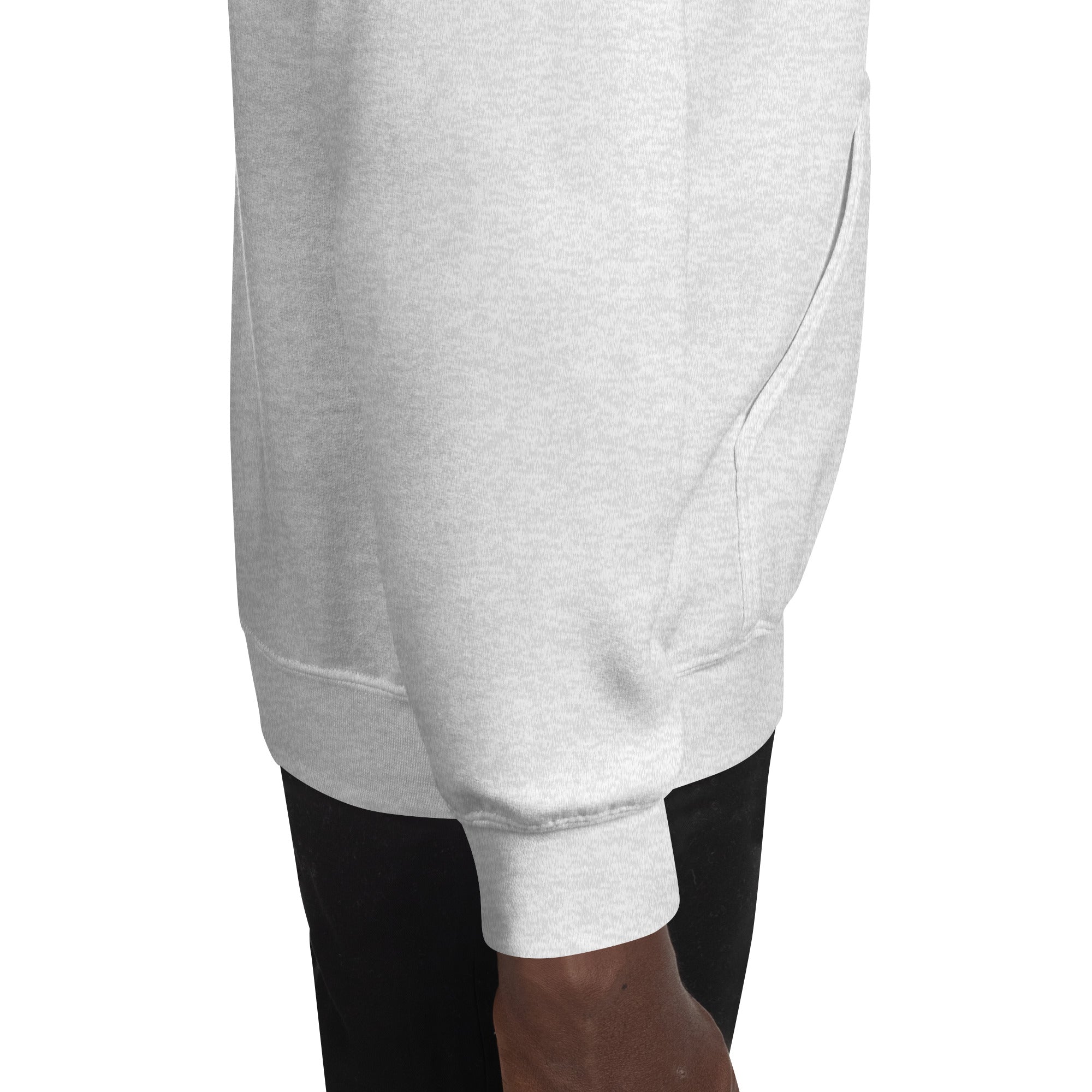 Light gray hoodie side seam and lower hem, ribbed cuff visible
