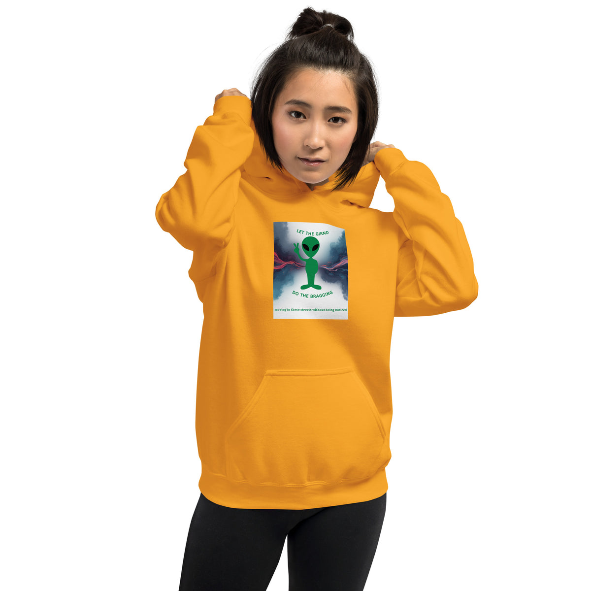 Orange pullover hoodie with front chest graphic and kangaroo pocket