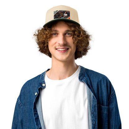 Tan 5-panel cap with front patch graphic and dark green brim