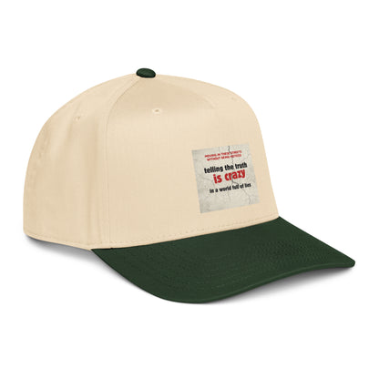Two-tone natural and dark green 5-panel cap with slogan patch on crown