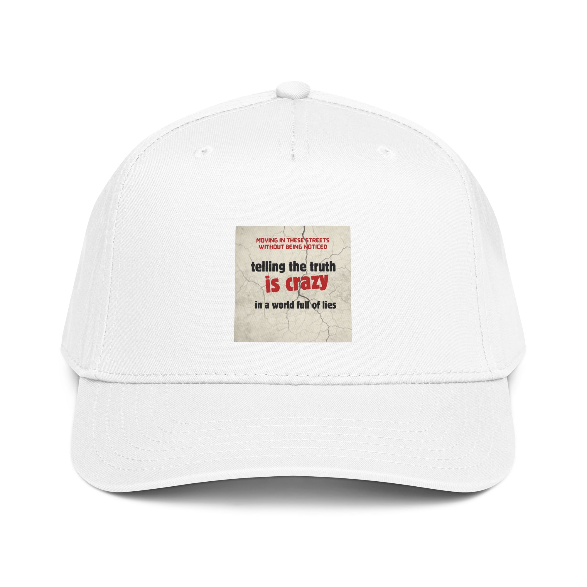 White 5-panel cap with front slogan patch: “telling the truth is crazy”