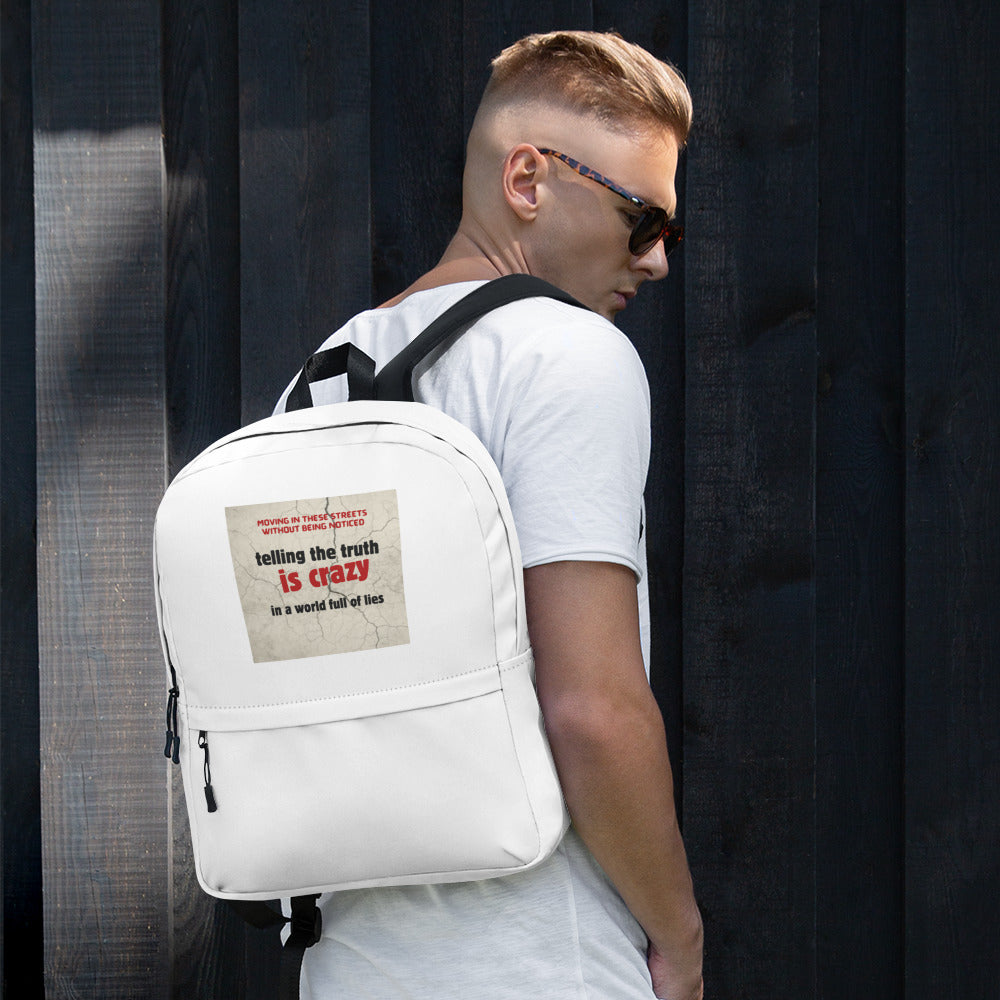 White canvas backpack with front pocket and adjustable shoulder straps