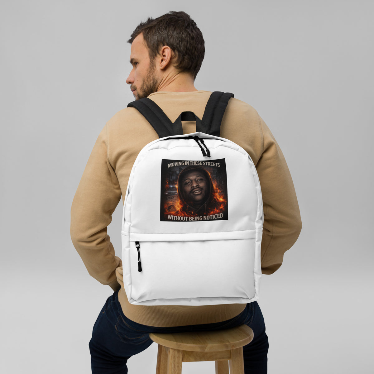 White backpack with front graphic panel and zippered front pocket