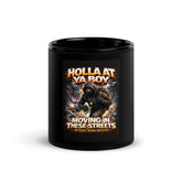 Black ceramic mug with full front graphic featuring hooded figure and text