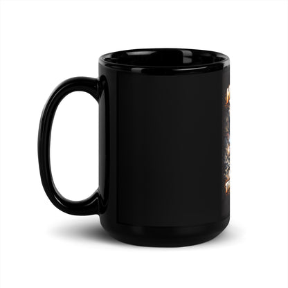 Black mug with handle, mostly blank side with small edge of artwork