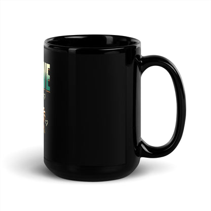 Black glossy mug with handle, minimal visible print