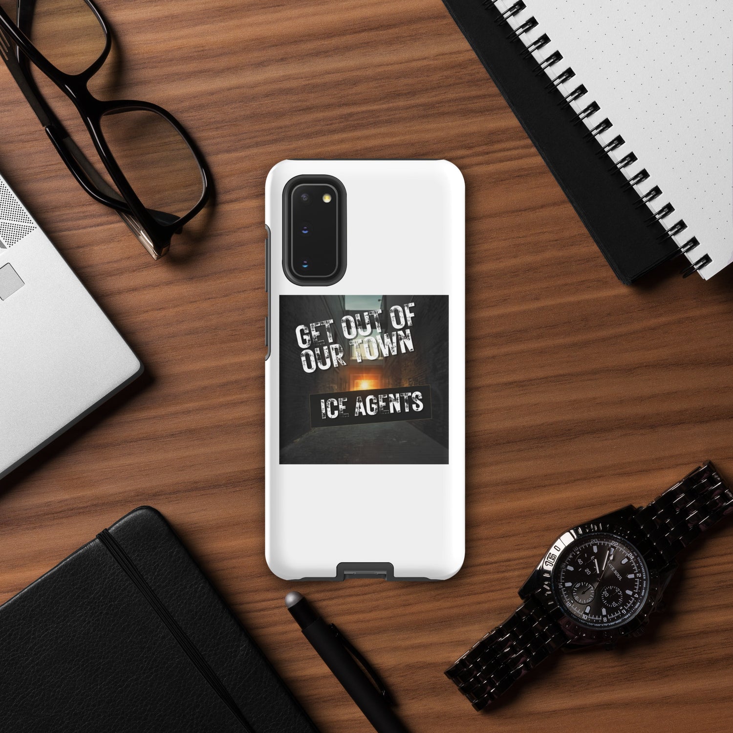 White Tough case with vertical “Get Out Of Our Town” “Ice Agents” graphic and camera cutout.