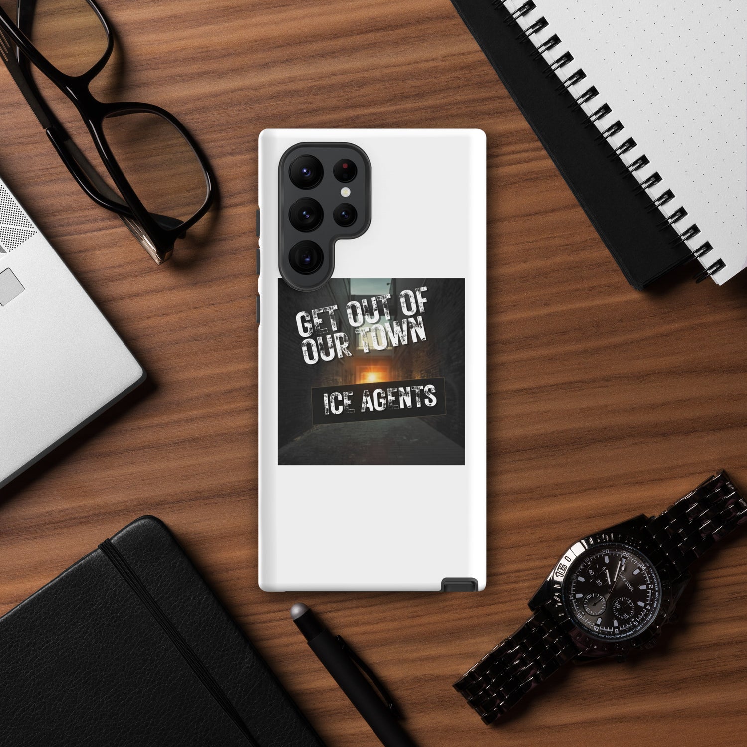 White phone case with raised black camera housing and “ICE AGENTS” graphic panel