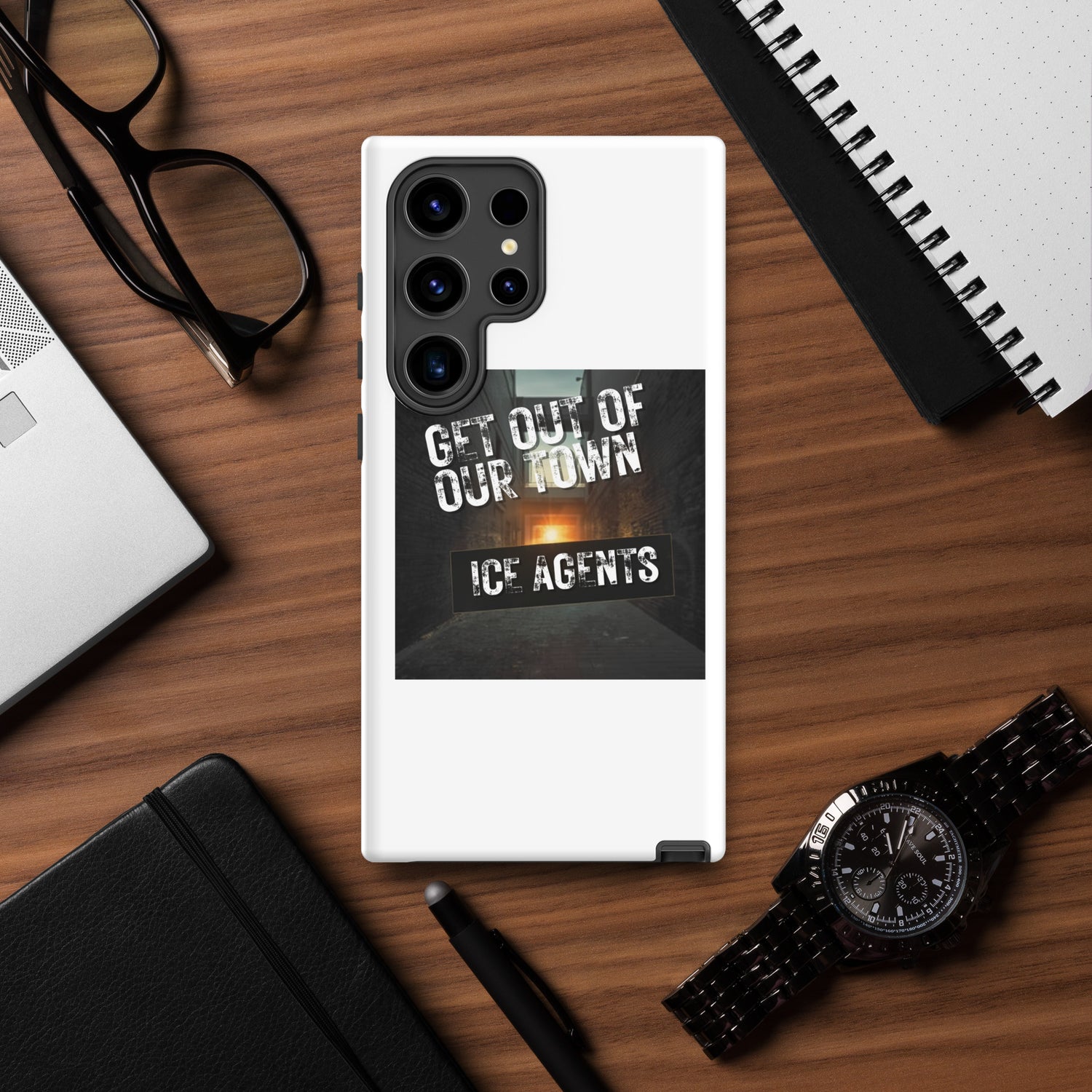 White phone case with black camera module, “ICE AGENTS” graphic, and edge protection