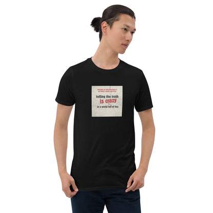Black T-shirt with square front graphic: “telling the truth is crazy”
