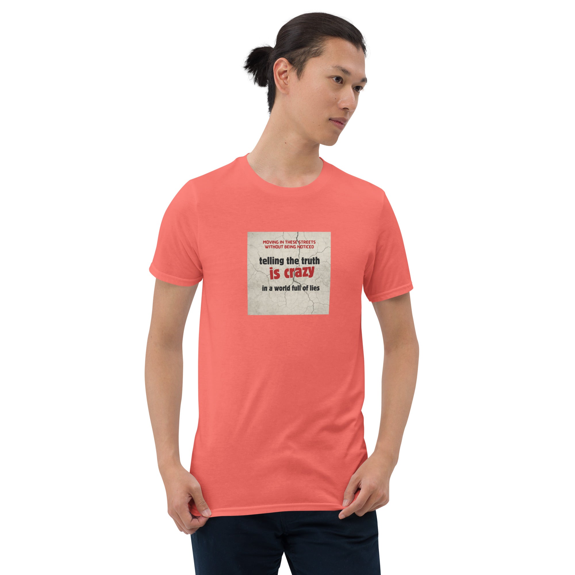 Coral/red T-shirt with front square “telling the truth is crazy” graphic