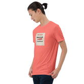 Coral crew-neck T-shirt with square front text graphic, angled view