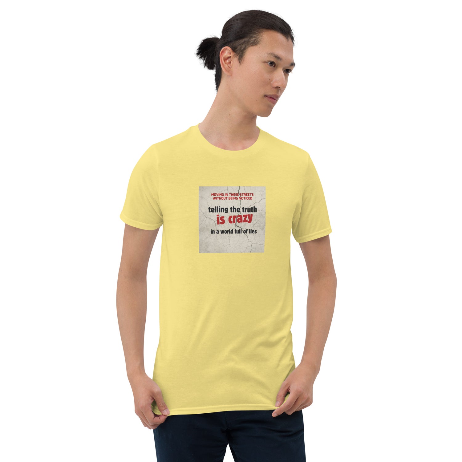 Yellow T-shirt with short sleeves and crew neck; square chest slogan graphic.