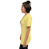 Yellow unisex t-shirt on model, side profile with partial back graphic