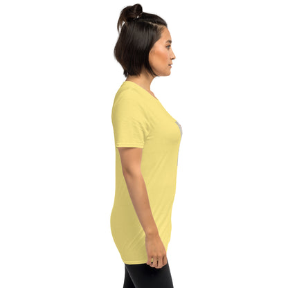Yellow unisex t-shirt on model, side view, short sleeves and crew neck