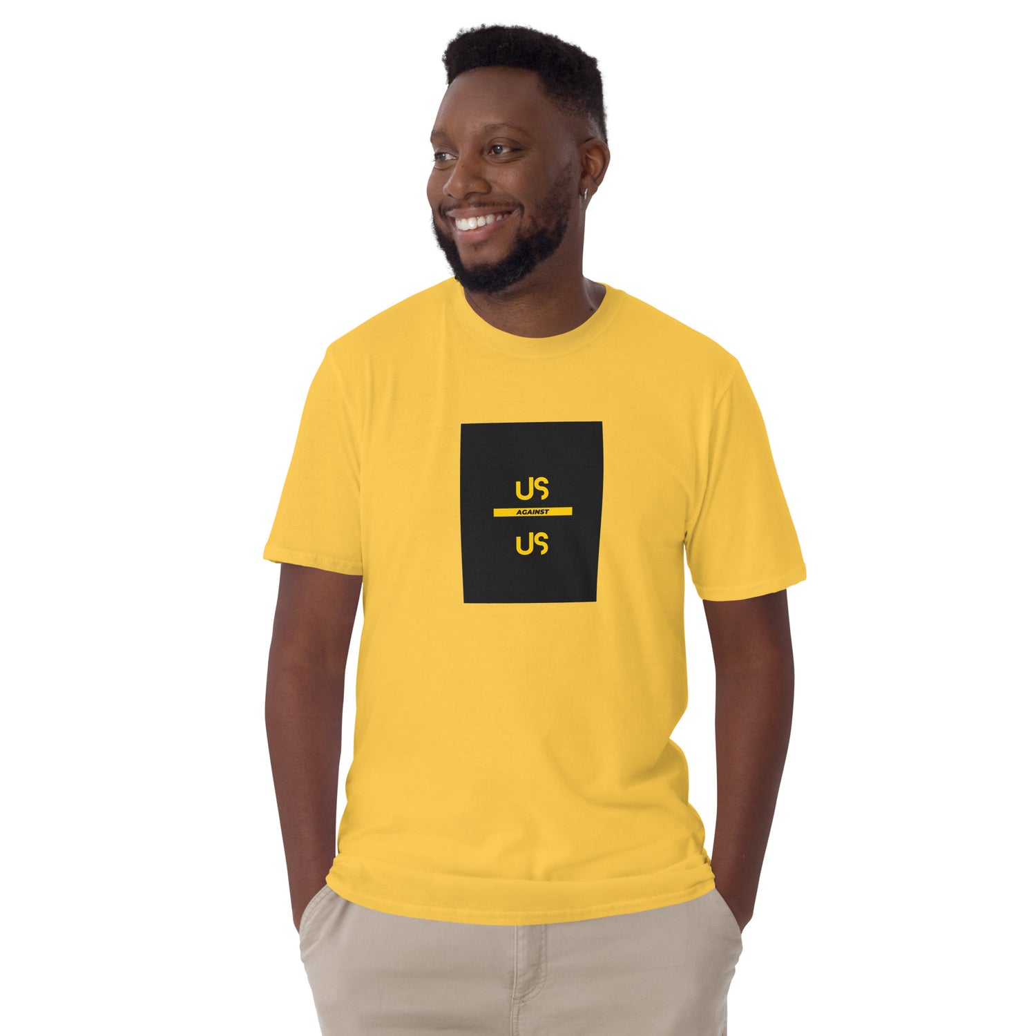 Yellow unisex short-sleeve T-shirt with front square “US AGAINST US” graphic