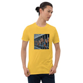 Yellow graphic T-shirt with square photo-style print on chest, crew neck, short sleeves