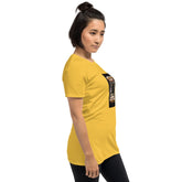 Unisex T-shirt in mustard yellow with side view of square graphic on sleeve