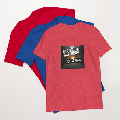 Heather red unisex T-shirt with square “Get out of our town” graphic; blue behind