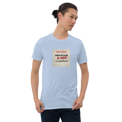 Light blue T-shirt with front graphic: “telling the truth is crazy”