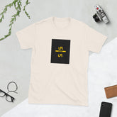 Light cream graphic tee with black square logo and yellow accents, front view