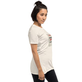 White unisex T-shirt with chest graphic shown from a side angle.