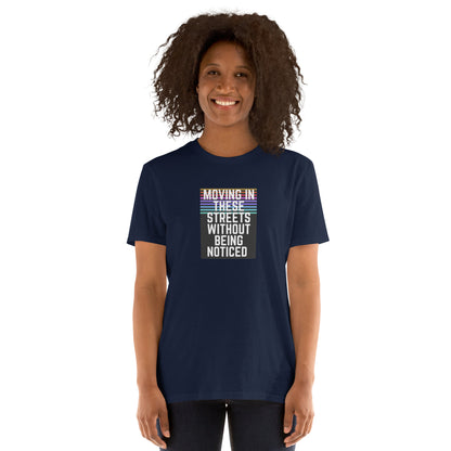 Navy T-shirt with centered “Moving In These Streets Without Being Noticed” front graphic