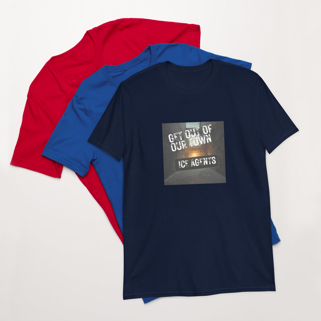 Navy unisex T-shirt with square “Get out of our town” graphic; red and blue behind