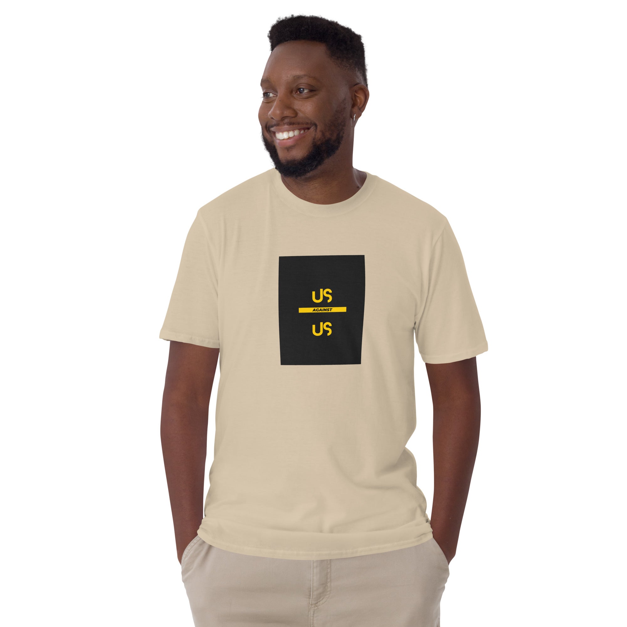 Natural/beige unisex short-sleeve T-shirt with front square “US AGAINST US” graphic