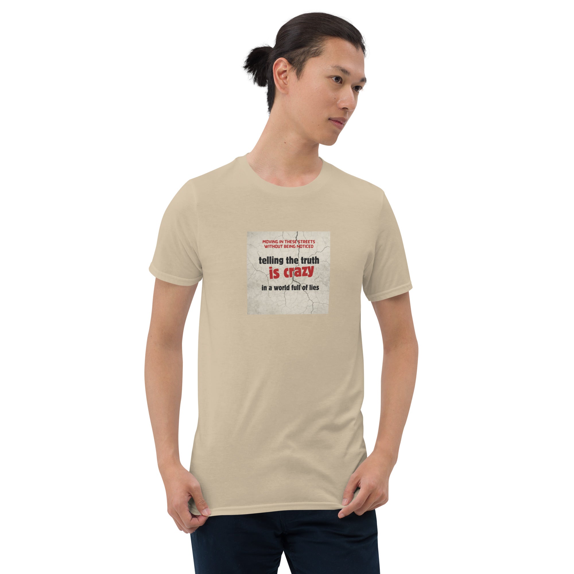 Sand/beige T-shirt with front square “telling the truth is crazy” graphic
