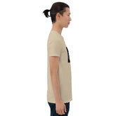 Beige unisex T-shirt side view with partial black chest graphic.