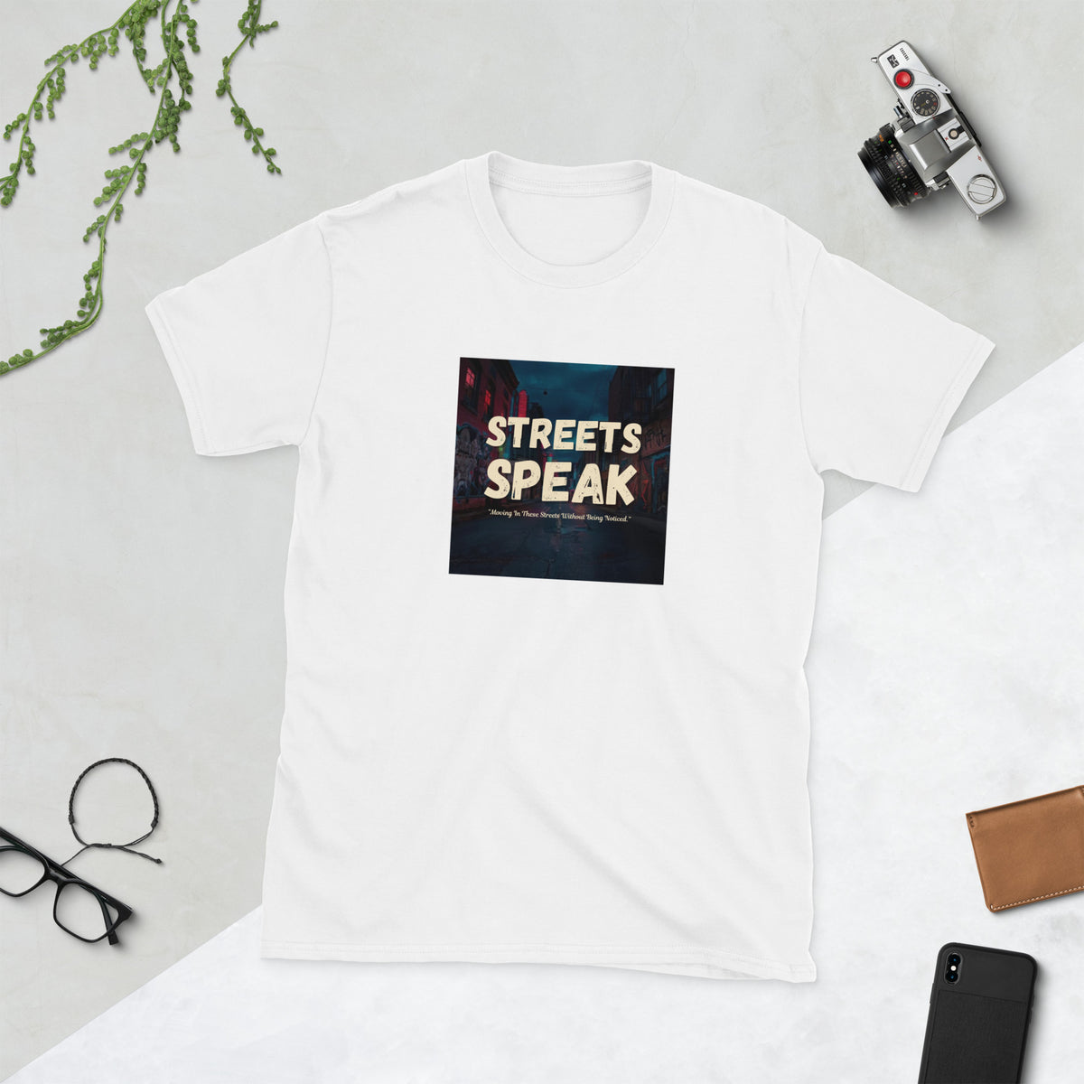 White crewneck graphic tee with square “STREETS SPEAK” front print