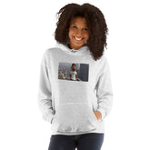 Light gray unisex pullover hoodie with hood, kangaroo pocket, and front graphic print