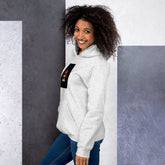 Unisex heather gray hoodie side view with pullover hood and front graphic patch