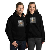 Unisex hoodie in black with front logo graphic, pullover hood, and kangaroo pocket