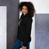Black unisex hoodie with chest graphic and drawstring hood, side view