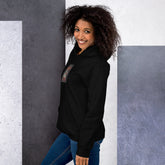 Black unisex hoodie with hood, kangaroo pocket, and chest graphic, side view