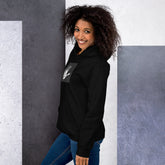 Black unisex hoodie side view with small chest handprint graphic