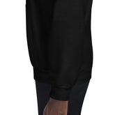 Unisex black hoodie hem and kangaroo pocket, close-up