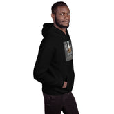 Black pullover hoodie with square chest graphic print, side view, hood and pocket.