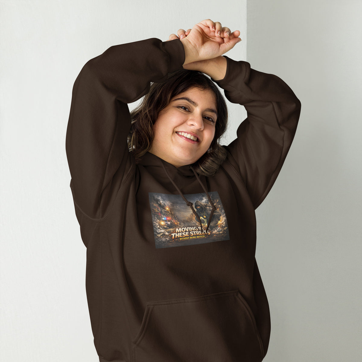 Dark brown pullover hoodie with hood, front pocket, and colorful street graphic on chest