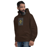 Dark brown unisex hoodie with hood, front pocket, and chest graphic