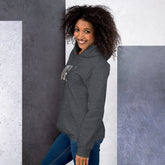 Dark gray pullover hoodie with hood, front pocket, and small chest photo graphic.